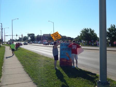 At 9 am the protest against Planned parenthood begins at the intersection of E. New York St. and Oakhurst Dr., Aurora, IL